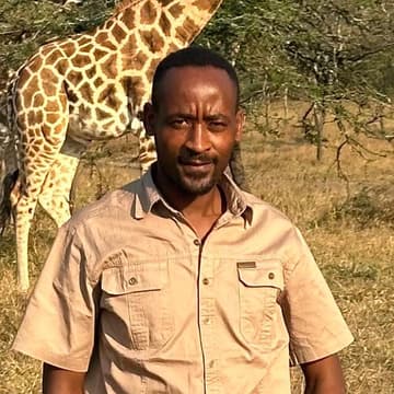 Portrait of Brian Mvuyekure, Tour Guide at Cinnamon Holidays Safaris